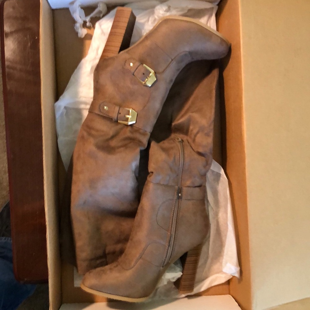 Tall pull on heeled boots.   #20